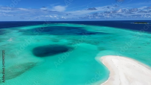 A tropical island with crystal clear ocean water. Maldives