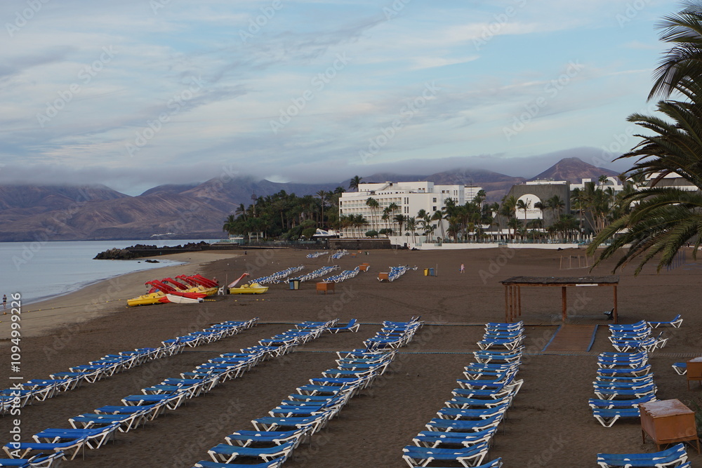 view on timanfaya, playa grande, beach, sun loungers, holiday, lanzarote, volcanoes, mountains, beautiful view, landscape, atlantic ocean, november 2024, pedal boats, sea, timanfaya view on timanfaya, playa grande, beach, sun loungers, holiday, lanzarote, volcanoes, mountains, beautiful view, landscape, atlantic ocean, november 2024, pedal boats, sea, timanfaya