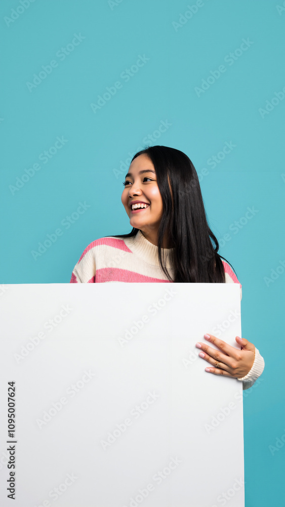 Cheerful Woman Peeking Behind Whiteboard: Perfect for Education, Presentations, or Marketing Campaigns Cheerful Woman Peeking Behind Whiteboard: Perfect for Education, Presentations, or Marketing Campaigns