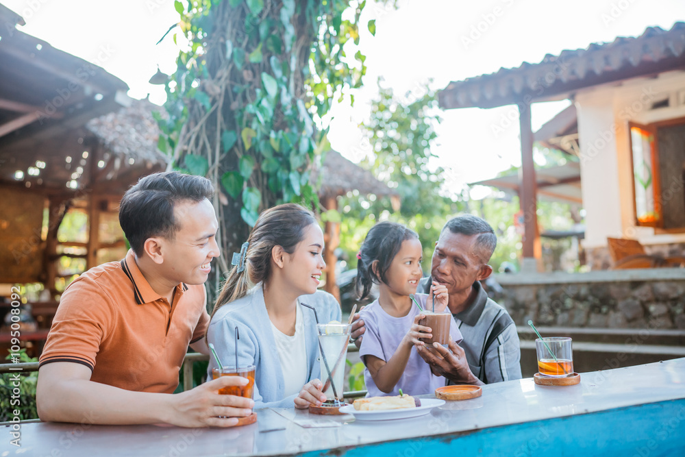 three generation asian family bonding by having lunch together in outdoor cafe three generation asian family bonding by having lunch together in outdoor cafe