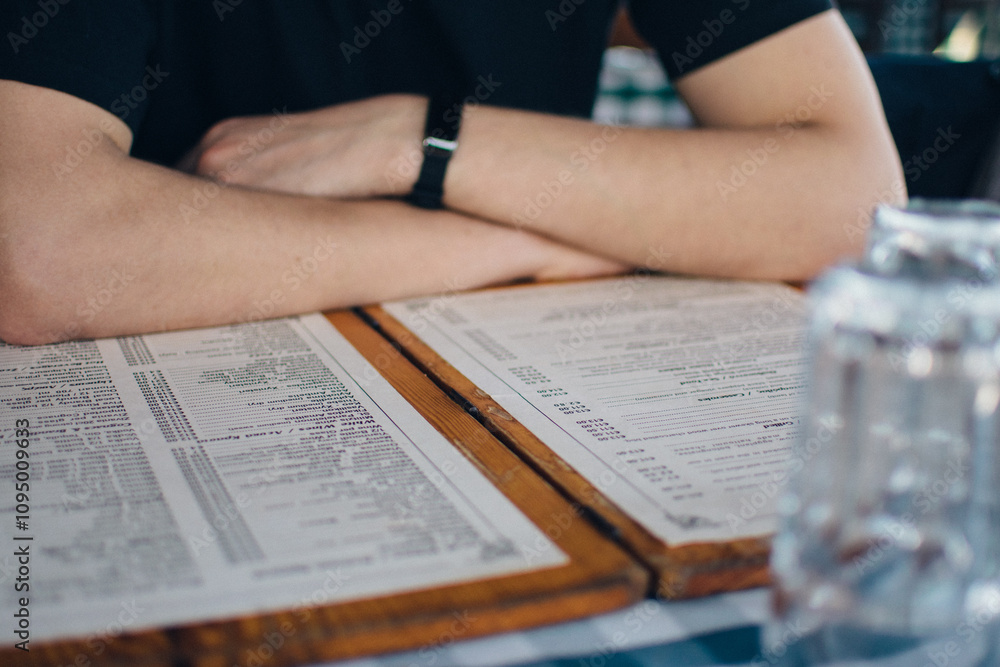 Fototapeta premium a young man enjoys a meal in a Greek restaurant