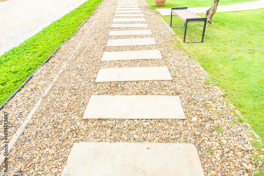 Marble walkway of square tiles in backyard of the mansion,Alley in tropical garden,Garden landscape design with pathway,Selective focus. Marble walkway of square tiles in backyard of the mansion,Alley in tropical garden,Garden landscape design with pathway,Selective focus.