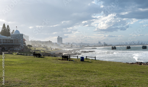 Port Elizabeth or Gqeberha, South Africa. Cityscape view from shark rock pier, cloudy blue sky