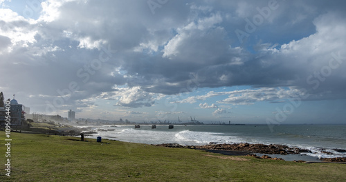Port Elizabeth or Gqeberha, South Africa. Cityscape view from shark rock pier, cloudy blue sky