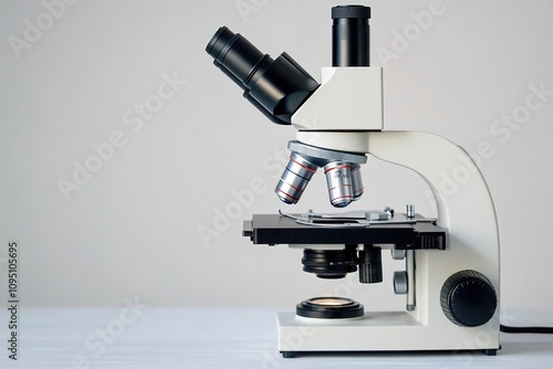 Close-up view of modern microscope on white background