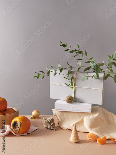 Creative still life with holiday decorations and gifts. Neutral background, copy space