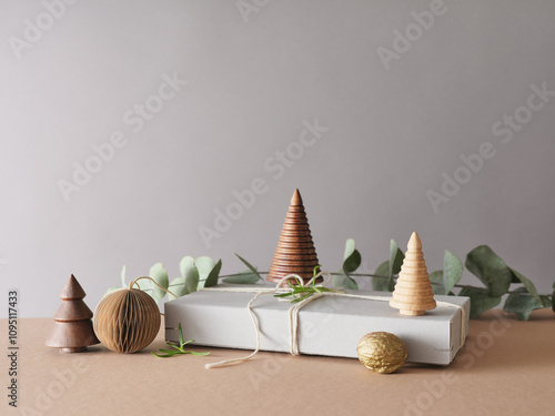 Creative still life with holiday decorations and gifts. Neutral background, copy space