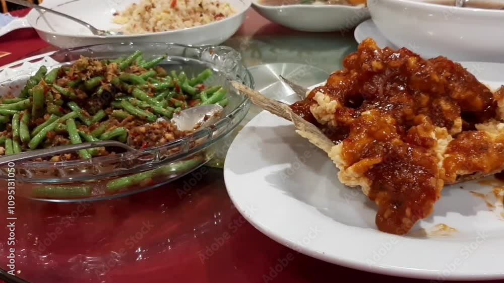 Sweet and Sour Fish with Green Beans Stir Fry and Other Delicious Chinese Cuisine Served on Red Round Table at Restaurant Authentic Gourmet Feast for Celebration Party Vibrant Traditional Asian Food Sweet and Sour Fish with Green Beans Stir Fry and Other Delicious Chinese Cuisine Served on Red Round Table at Restaurant Authentic Gourmet Feast for Celebration Party Vibrant Traditional Asian Food