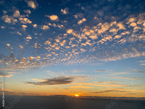 Sunset Sky over the Atlantic Ocean with Cotton Clouds