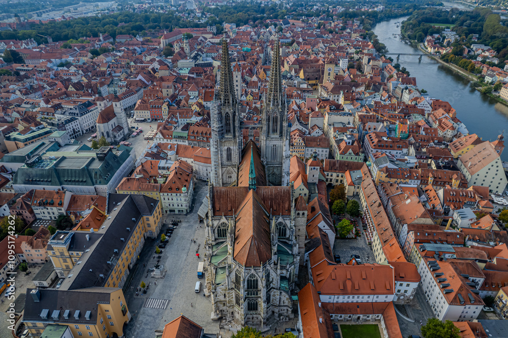 Naklejka premium Beautiful aerial view of Regenesburg, its massive gothic St Peter cathedral, the Danube river and the Old Stone Bridge