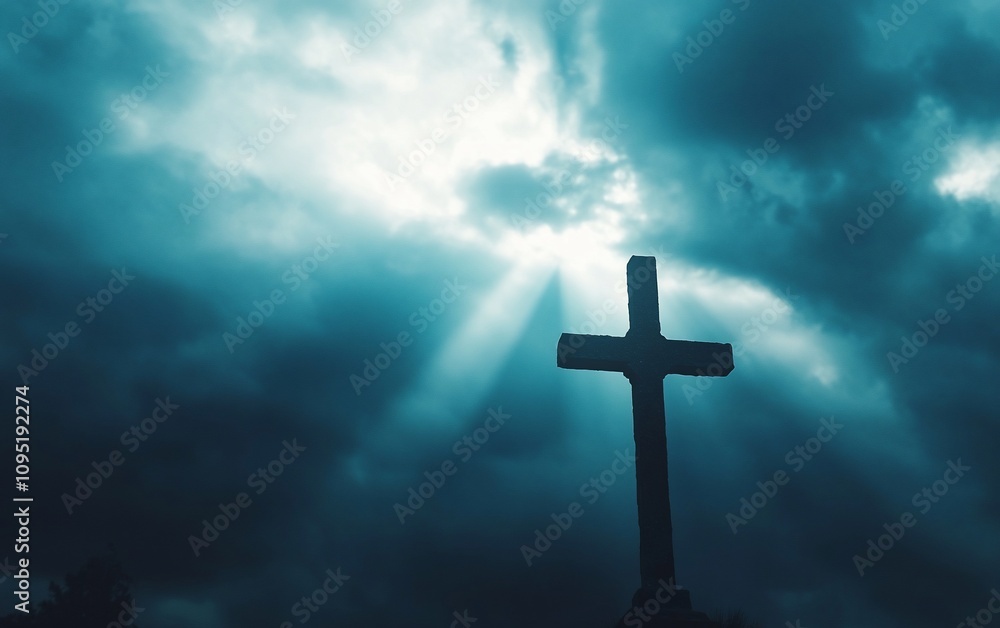 A silhouette of a cross against a backdrop of dark clouds and light rays. A silhouette of a cross against a backdrop of dark clouds and light rays.