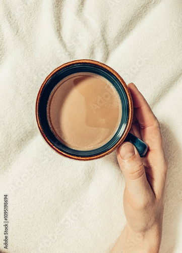 Hand Holding a Cup of Coffee