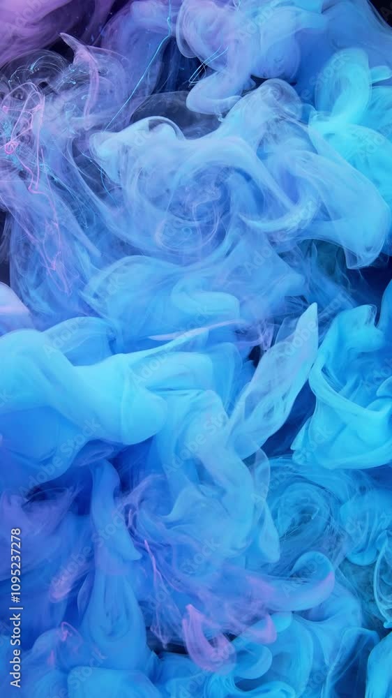 Watch blue and purple ink swirl in water, creating mesmerizing and enchanting patterns Watch blue and purple ink swirl in water, creating mesmerizing and enchanting patterns