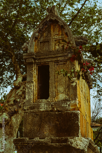 lycian stone carved sarcophagi in the middle of mediterranean town Kas in Turkey, timeless open air landmark monument photo