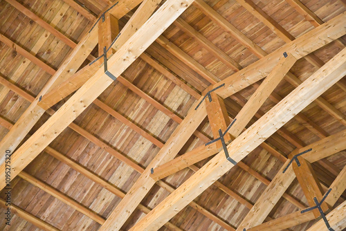 New wooden truss structure called palladian truss with beams and wooden roof photo