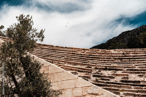 hellenistic antique amphitheatre Antiphellos with the sea view, rustic timeless historical archaeological site photo