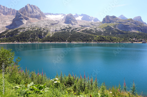 Lake FEDAIA at the foot of Mountain Marmolada in the Italian Alps and you can see the glacier photo