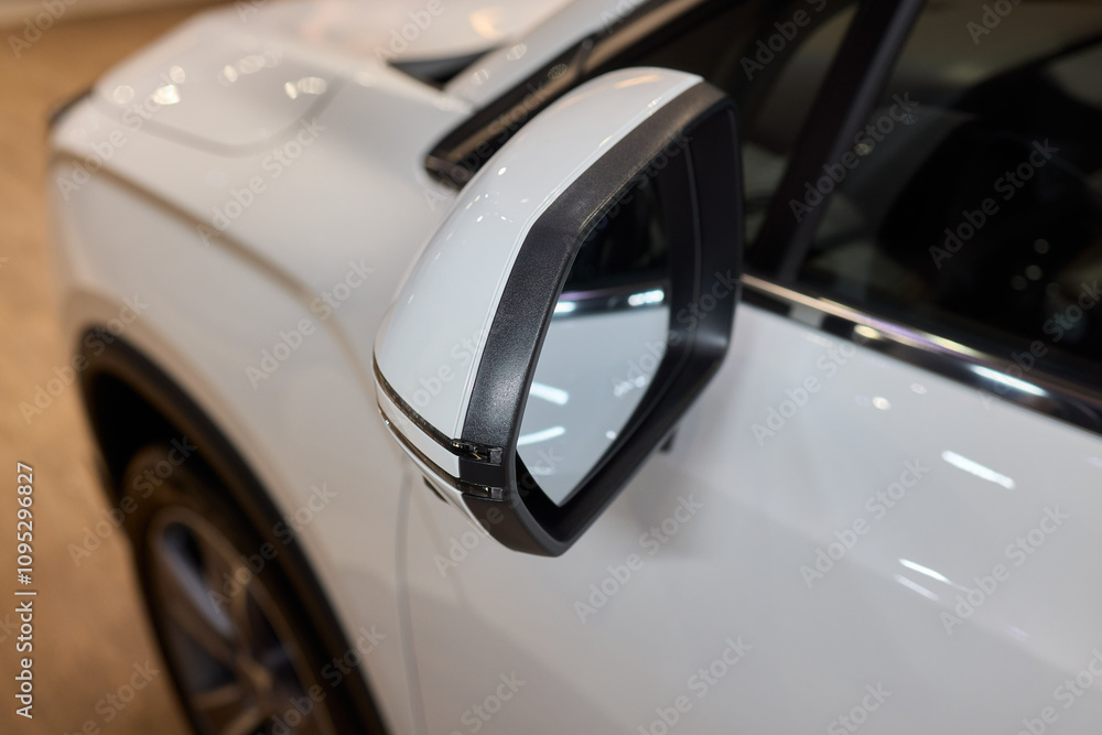 An elegant closeup shot of a sleek car side mirror showcasing its design and details An elegant closeup shot of a sleek car side mirror showcasing its design and details