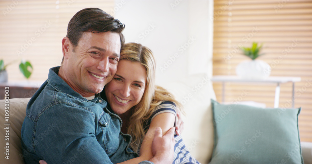 Portrait, smile and couple hug in home for love, support or romantic connection to partner in marriage. Face, happy man and woman embrace in living room for loyalty, trust and commitment in Germany Portrait, smile and couple hug in home for love, support or romantic connection to partner in marriage. Face, happy man and woman embrace in living room for loyalty, trust and commitment in Germany