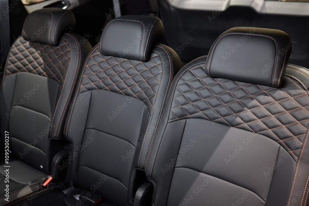 Obraz premium Car back seat with headrest and arm rest, a comfortable automotive fixture