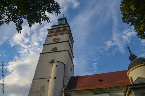 Cathedral of the Nativity of the Blessed Virgin Mary in Żywiec – a temple built in the fifteenth century with a high tower with a clock on it photo