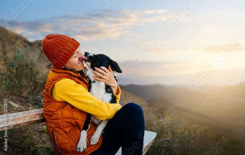 Photography Happy woman embracing her dog at sunset outdoors. Life with dog.