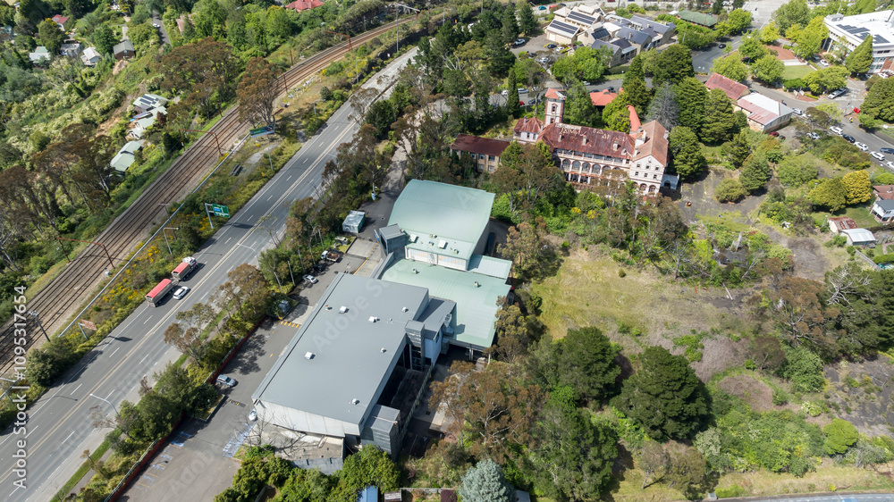 Fototapeta premium Drone aerial photograph of the old Renaissance Centre building adjacent to the Great Western Highway near the local Cinema precinct in Katoomba in the Blue Mountains in New South Wales, Australia.