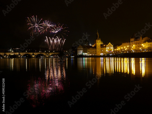 Photography New Year's colorful fireworks with reflection on the river surface, festive mood