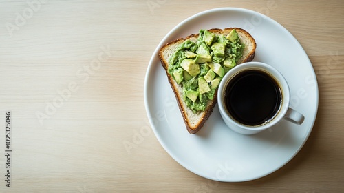 Avocado toast and coffee on a wooden table.