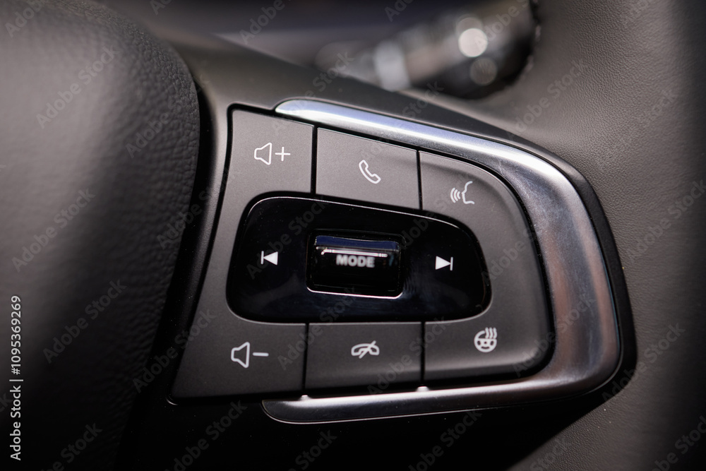 Fototapeta premium The modern cars steering wheel control panel boosts convenience and performance