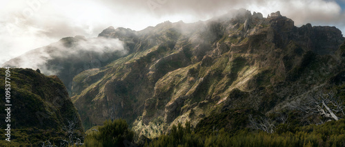 Levada In The Mountains Of Madeira, With The Sun And Some Clouds In The Sky