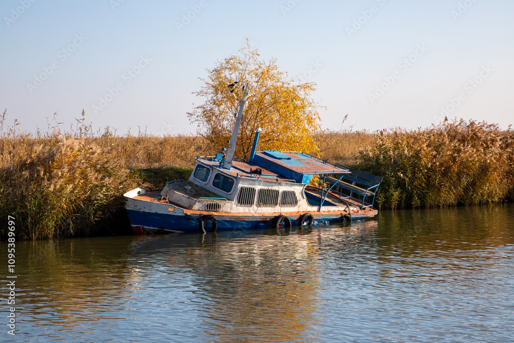 An old wrecked boat, abandoned on the shore An old wrecked boat, abandoned on the shore