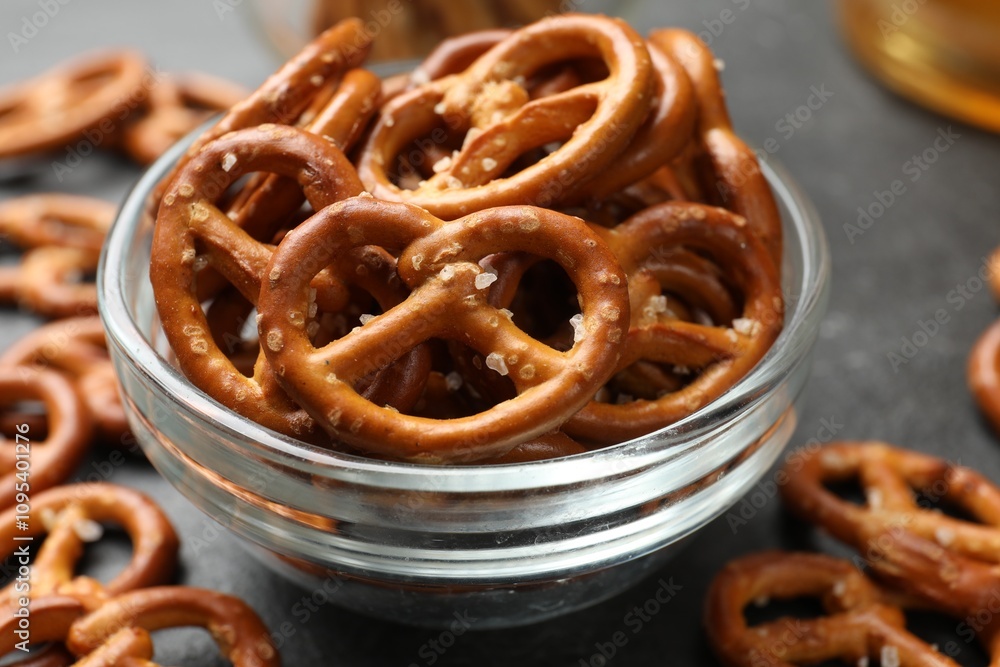 Delicious pretzel crackers on black table, closeup Delicious pretzel crackers on black table, closeup
