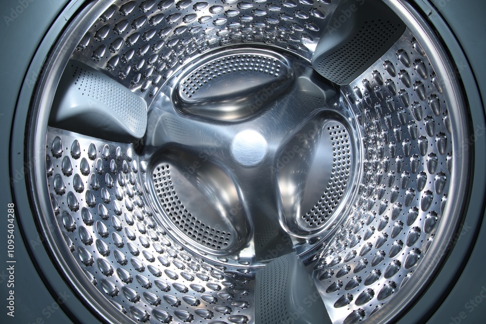 Washing machine with empty drum as background, closeup Washing machine with empty drum as background, closeup