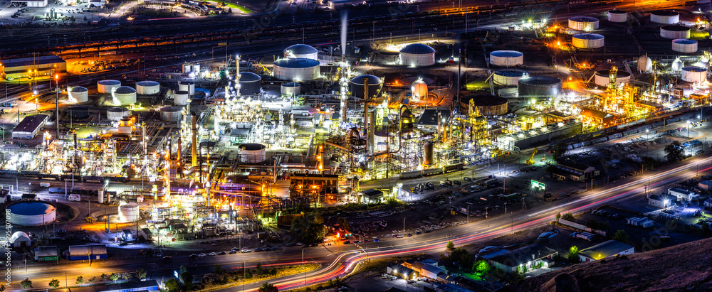 Panoramic view of an illuminated oil refinery plant at night, in Salt Lake City, Utah