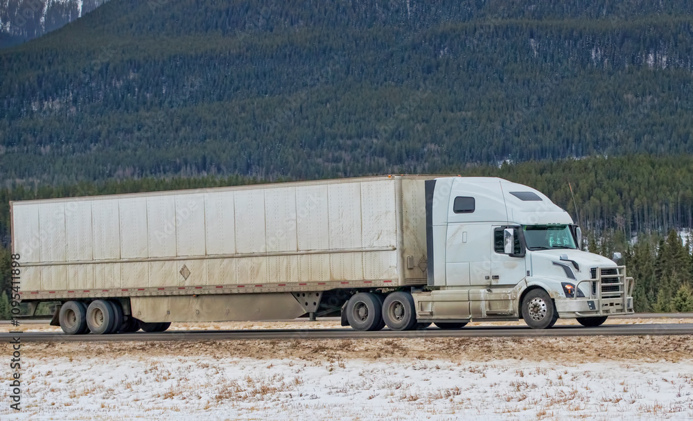 Heavy Cargo on the Road. A truck hauling freight along a highway. Taken in Alberta, Canada Heavy Cargo on the Road. A truck hauling freight along a highway. Taken in Alberta, Canada