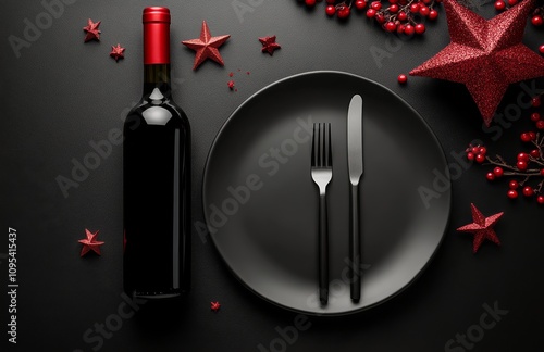 Festive table setting with black plate, wine bottle, and Christmas decoration...