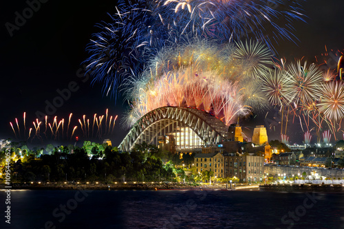 Sydney Harbour Bridge New Years Eve fireworks, colourful NYE fire works lighting the night skies with vivid multi colours NSW Australia. 