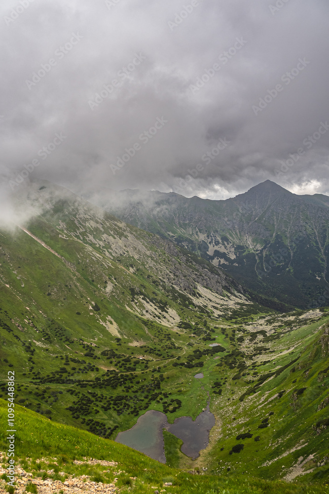 clouds over the mountains, view of the western Tatras in summer under a cloudy sky