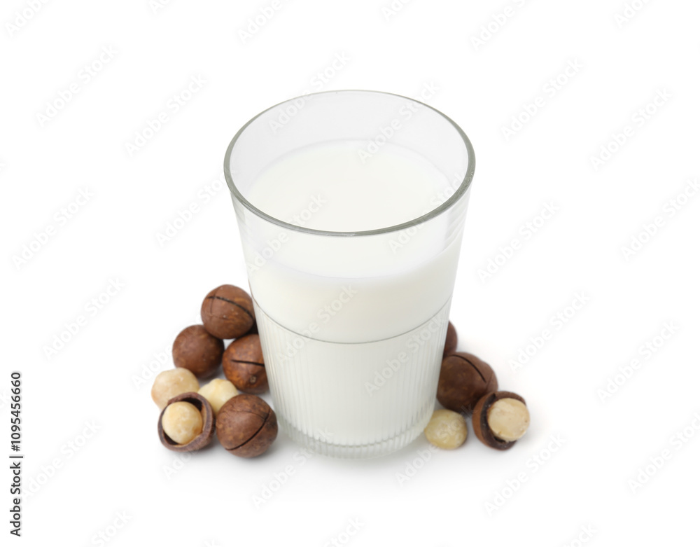 Glass of macadamia milk and nuts isolated on white Glass of macadamia milk and nuts isolated on white