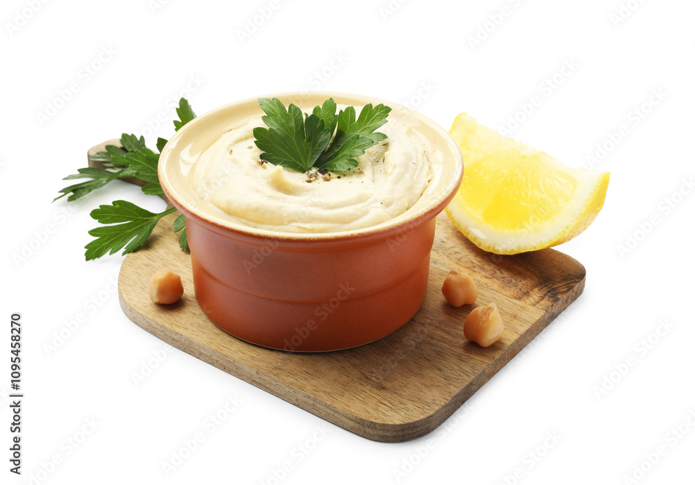 Delicious hummus with chickpeas, parsley and lemon isolated on white Delicious hummus with chickpeas, parsley and lemon isolated on white