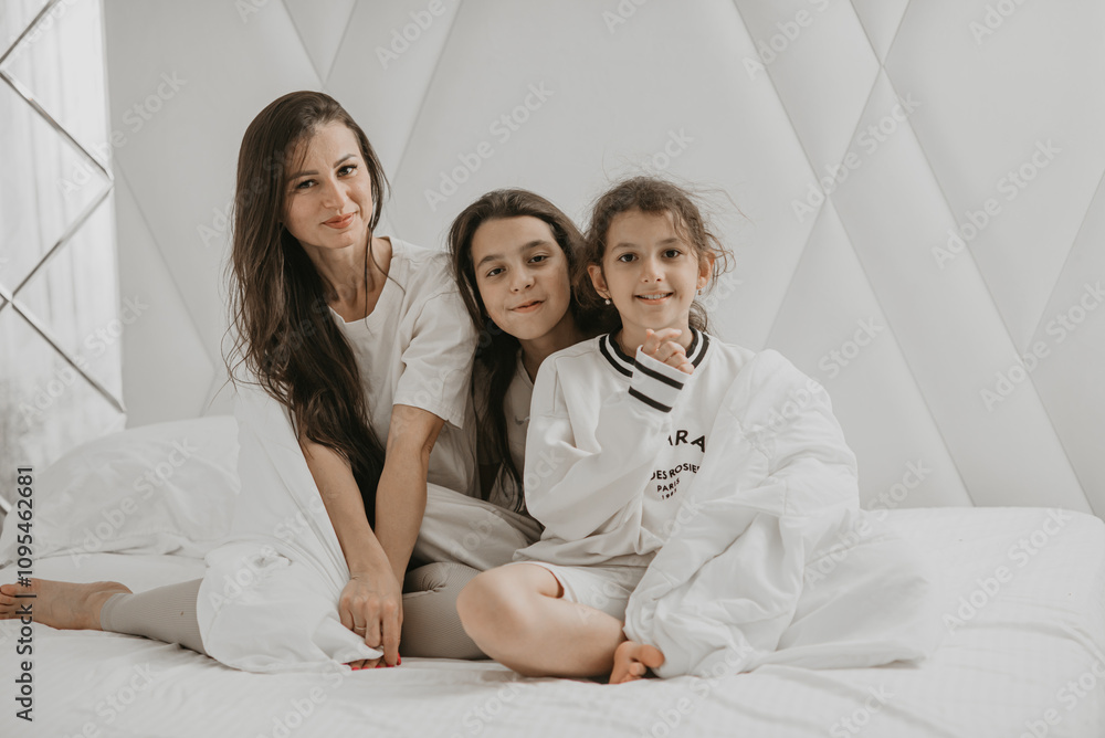 Family playing under a sheet together Family playing under a sheet together