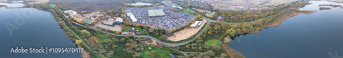 Aerial Panoramic View of Car Auctions Massive Car Parking Lot at Kempston Village of Bedford England United Kingdom. High Angle Footage Captured During Cloudy Evening on November 18th, 2024 photo