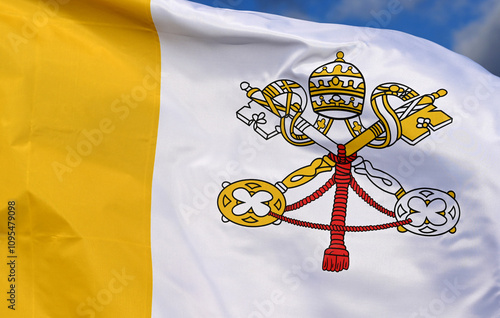 Close-up of the national flag of Vatican State,fluttering in the wind with folds, wave pattern