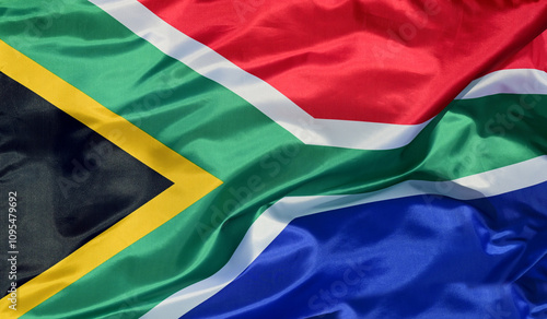 Close-up of the national flag of South Africa, fluttering in the wind with folds, wave pattern