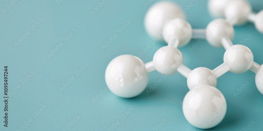 A close-up of a molecular structure with white spheres on a teal background, representing scientific concepts in chemistry or biology. A close-up of a molecular structure with white spheres on a teal background, representing scientific concepts in chemistry or biology.