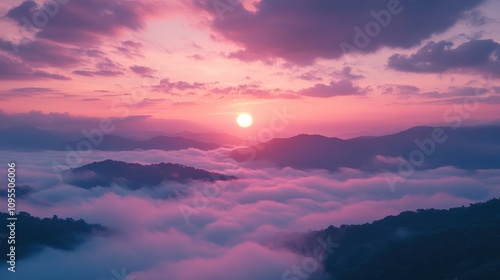 Colorful sunset above clouds over mountain peaks, glowing sky, scenic view, serene atmosphere, tranquil nature, peaceful moment, breathtaking beauty, golden light, heavenly landscape