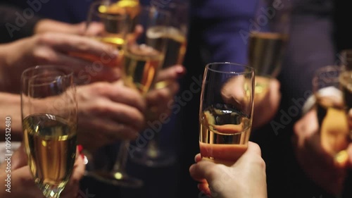 Group of businessmen celebrate, closing successful concluded deal, guests clinking raise glasses with alcohol, sparkling wine, toasting and cheering, colleagues team in office on corporate party event