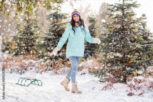 Full size photo of young beautiful charming pretty girl go walk with sledge in park forest having fun winter vacation #1095515291