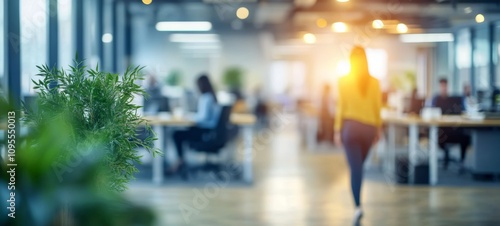 Modern Office Interior with Blurred People and Greenery for Collaborative Work Environment